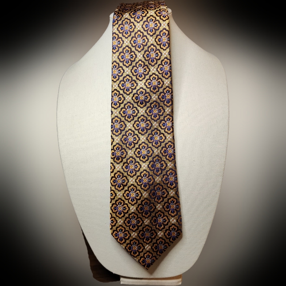 CM Gold Series Tie in gold, orange, blue and black flower pattern